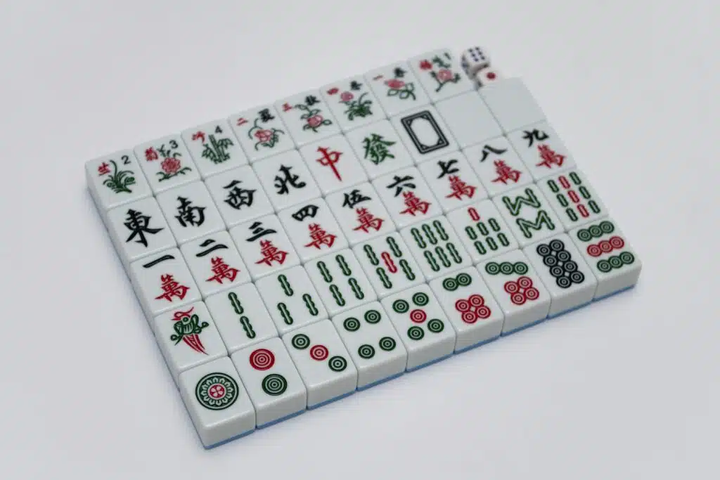 pexels photo 14786923 14786923 | Feeron %%image_title%% - Premium Custom Dice Manufacturer | %%sitename%% A detailed view of Mahjong tiles arranged on a white background, showcasing traditional Chinese symbols. %%image_title%% - Custom %%product_cat%% by Feeron